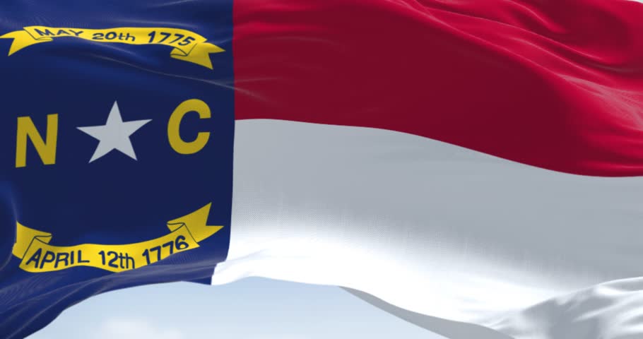 North Carolina state flag waving. North Carolina is a state in the Southeastern region of the United States. Rippled fabric. 3d render animation. Slow motion loop. Close-up. Textured background