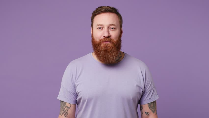 Young cheerful happy positive optimistic caucasian european man 30s wearing casual clothes looking camera smiling isolated on plain pastel light purple background studio portrait. Lifestyle concept Royalty-Free Stock Footage #1100448665