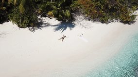 Aerial view of surfer at tropical island. High quality 4k footage