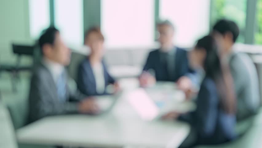 Group of businessperson meeting in the office. Blurred image. Royalty-Free Stock Footage #1100449579