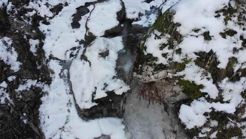 Caucasus, North Ossetia. Midagrabin Gorge. Frozen bed of the river Fyrydon.