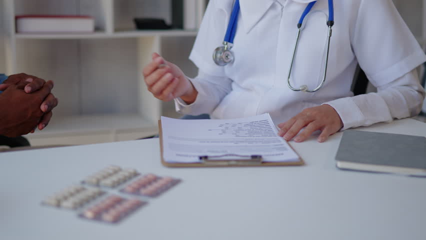 Close up of doctor's hands is explaining and advising about using pills medicine and treatment to patient. | Shutterstock HD Video #1100455653