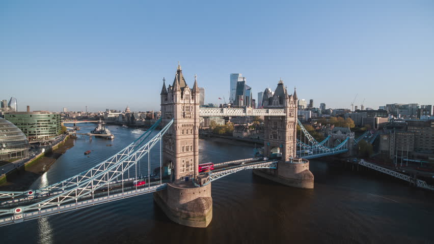 Day, slow rise and push across Tower Bridge toward City of London, Square Mile, Establishing Aerial View Shot of London UK, United Kingdom Royalty-Free Stock Footage #1100457471