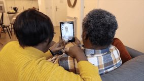 African American senior couple talk to their doctor over video call from home - Powered by Shutterstock - Get 15% off with code: PIKWIZARD15
