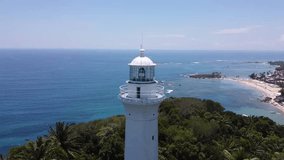 aerial video of drone rotating around lighthouse on morro de são paulo island in Bahia