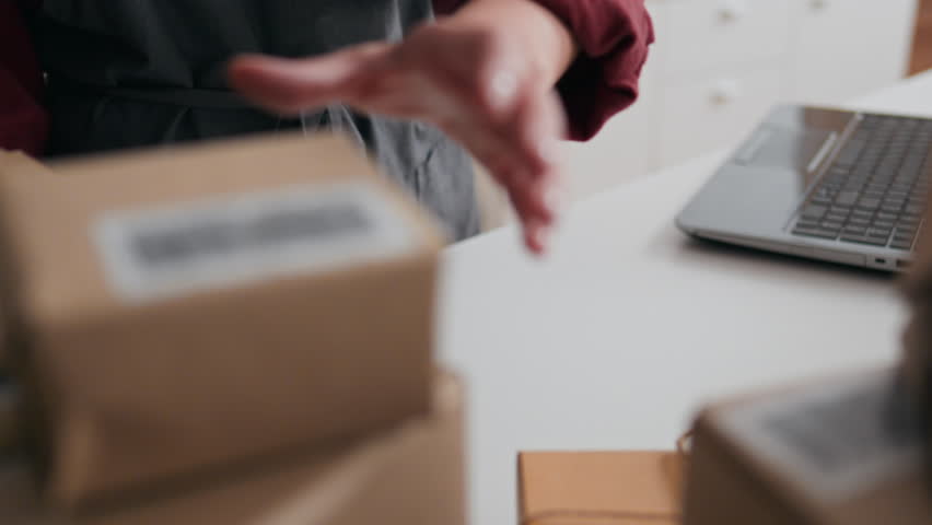 E-commerce, Small business owner Confident working in a courier service room Camera on the move Transportation center worker unloading parcels Progressive business, parcel
 | Shutterstock HD Video #1100463341
