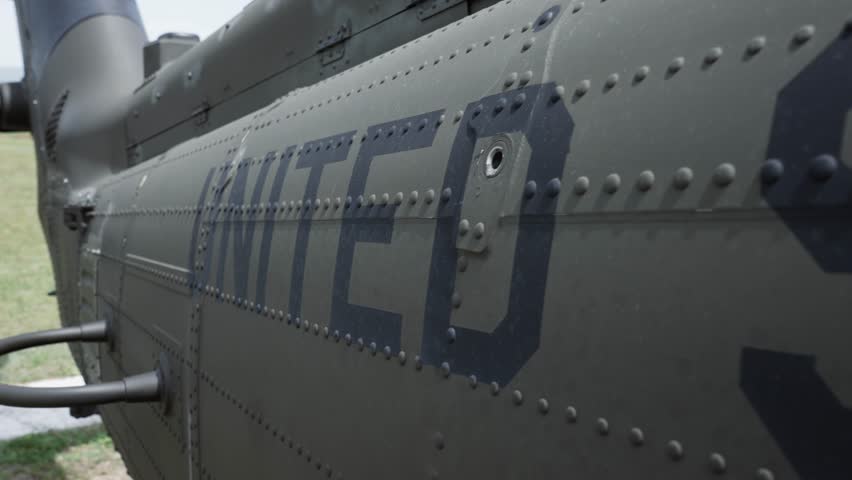 Millitary chopper helicopter with marking US Army insignia on the side