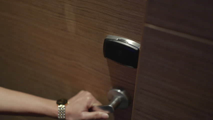 Woman using proximity card, contactless digital key to opening door of room in hotel. Digital or keyless to authenticate. | Shutterstock HD Video #1100469395