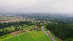 Drone parallax footage of a village between mountains