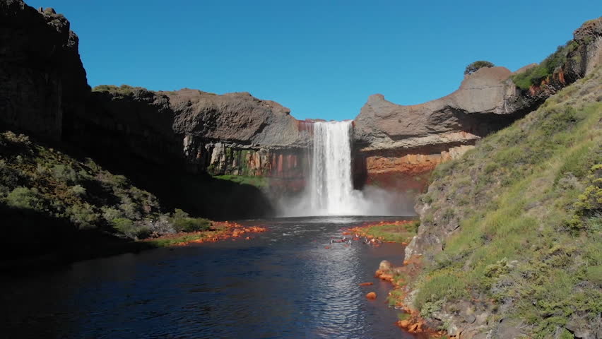 AERIAL - Rainbow in Salto del Agrio waterfall, Caviahue, Argentina Patagonia, forward