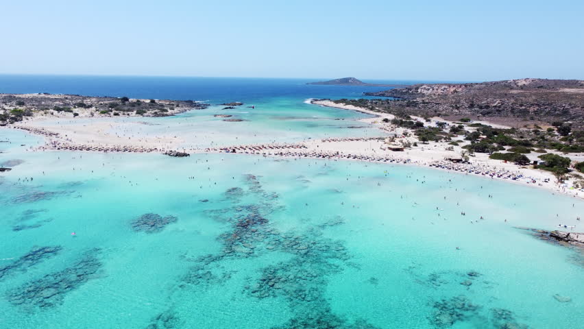 Aerial view towards Elafonisi beach island, Crete, Greece with azure tropical seascape Royalty-Free Stock Footage #1100472171
