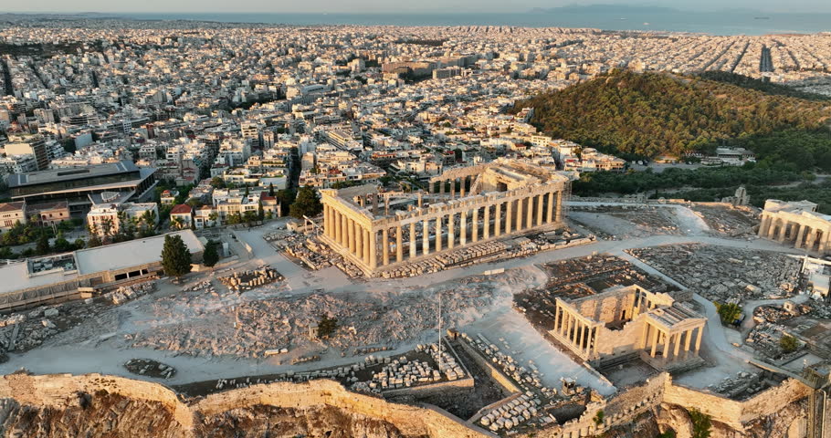 Incredible views over the Acropolis at sunrise in the city of Athens, Greece.