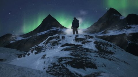 Adventure Man on top of Rocky Mountain Landscape. Nature Background. Cloudy Sky at Night with stars and northern lights. 3d Rendering. 3D Illustration - Βίντεο στοκ