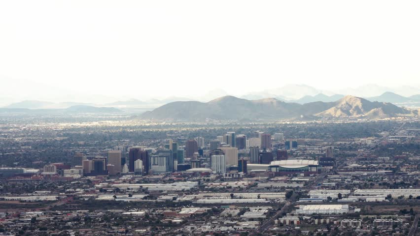 View of the Downtown Phoenix with the mountains in the background.
