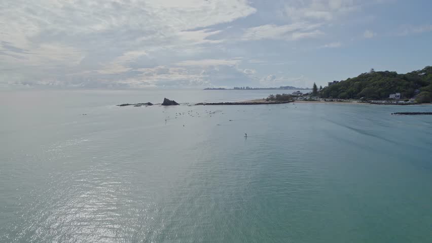 Surfers At The Currumbin Beach With Iconic Rock Formations In Summer - Surfing In Gold Coast, Queensland. wide aerial