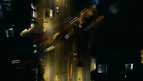 Stunning night street view from a drone's perspective. A time-lapse hyperlapse captures the hustle and bustle of car traffic in a captivating sequence. Perfect for stock video content.