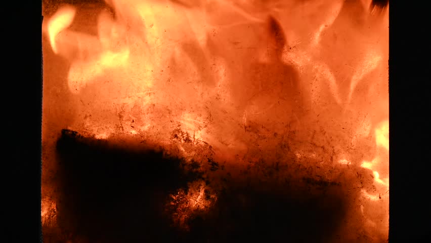 Fire in a closed fireplace as a close-up