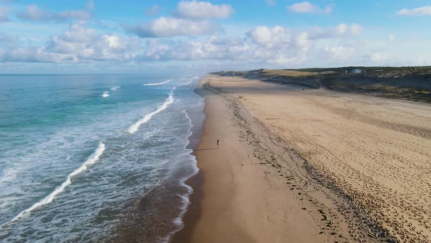 girl woman female alone lonely solo walk walking on the beach plage no one nobody one person horizon lacanau ocean gironde nouvelle aquitaine France explorer peaceful feeling drone aerial view happy