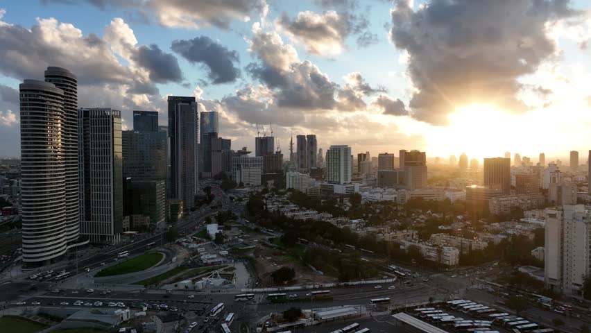 Tel Aviv skyline business center.
aerial drone view at sunset.
new light train construction. Royalty-Free Stock Footage #1100483455