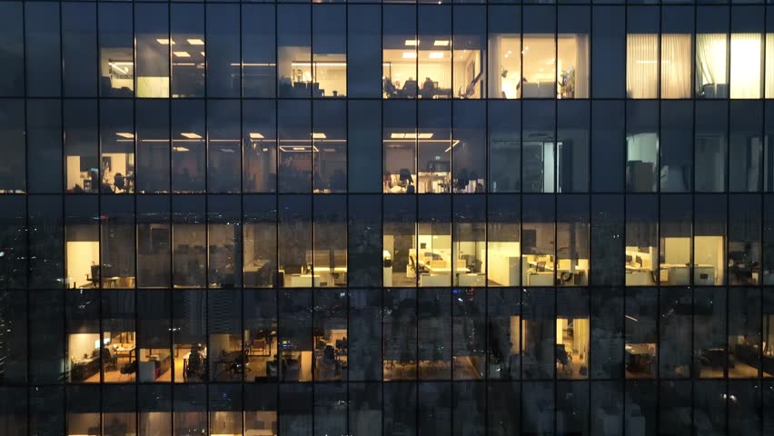 Office building at night,  aerial view trough the  windows. | Shutterstock HD Video #1100483845