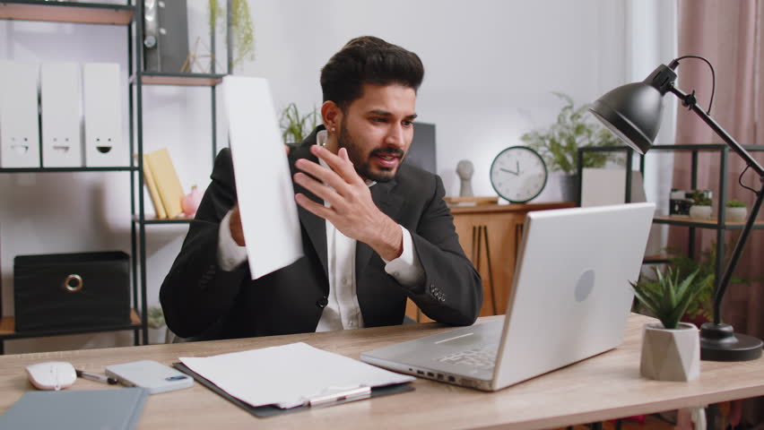 Conflict Quarrel Negotiation. Angry businessman ceo making webcam laptop online video call at office. Upset mad freelancer man talking colleague conversation analyzing financial report mistake problem | Shutterstock HD Video #1100486823