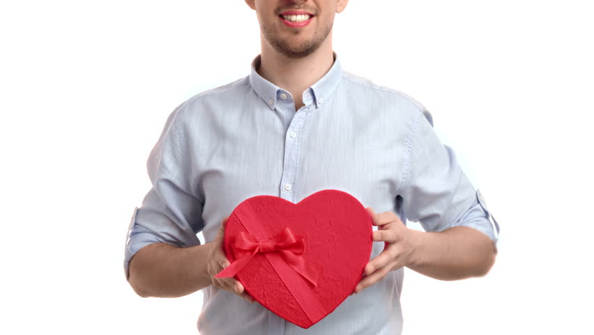 Unrecognizable man giving present gift box heart shape Valentine's Day holiday celebration isolated on white. Handsome smiling male romantic love congrats wrapped red container best feelings surprise Royalty-Free Stock Footage #1100488765