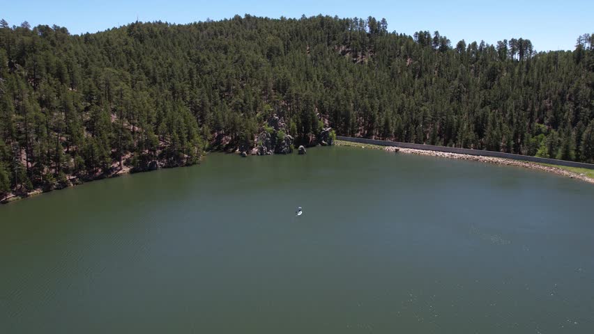 Paddleboarding in Center Lake, Custer State Park, South Dakota. Aerial View of Paddleboarder and Landscape