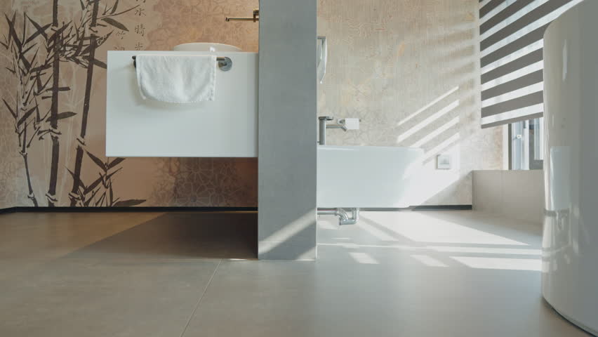 A modern Italian minimalist bathroom. Clean lines and neutral tones create a spa-like atmosphere, perfect for relaxation and rejuvenation Royalty-Free Stock Footage #1100500035