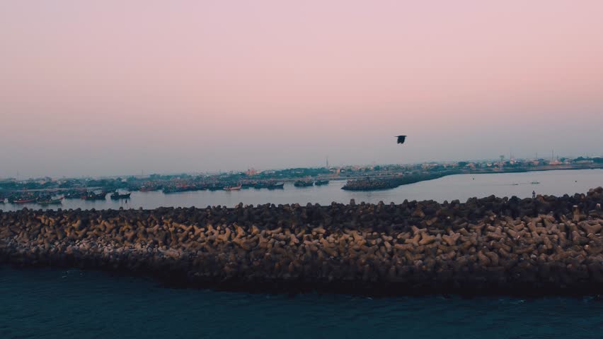 Rocky shore and boats loop
