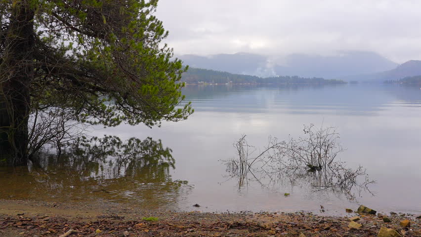 Establishing shot of Mountain Lake with Dramatic Clouds in Vancouver, Canada, North America. Day time on May 2021. Still camera view. ProRes 422 HQ.