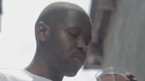 water is life, video of a young man taking a glass of water 
