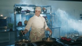 Woman chef preparing a recipe. Cooking risotto. Modern professional kitchen.
