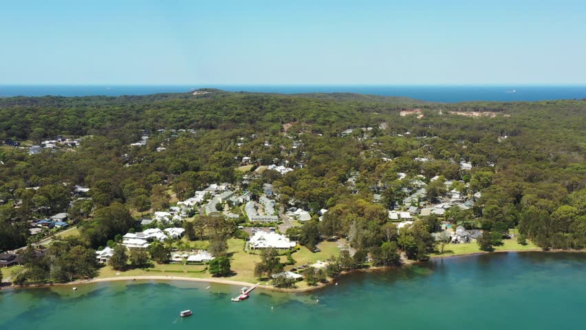 Lake Macquarie Murrays beach tree woods town residential streets houses.
 Royalty-Free Stock Footage #1100512707