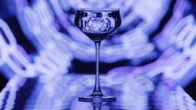 The clear wine glass stands infront of blue hexagonal tube patterns. The patterns are moving at slow speeds at the background. High quality 4k footage - Powered by Shutterstock - Get 15% off with code: PIKWIZARD15