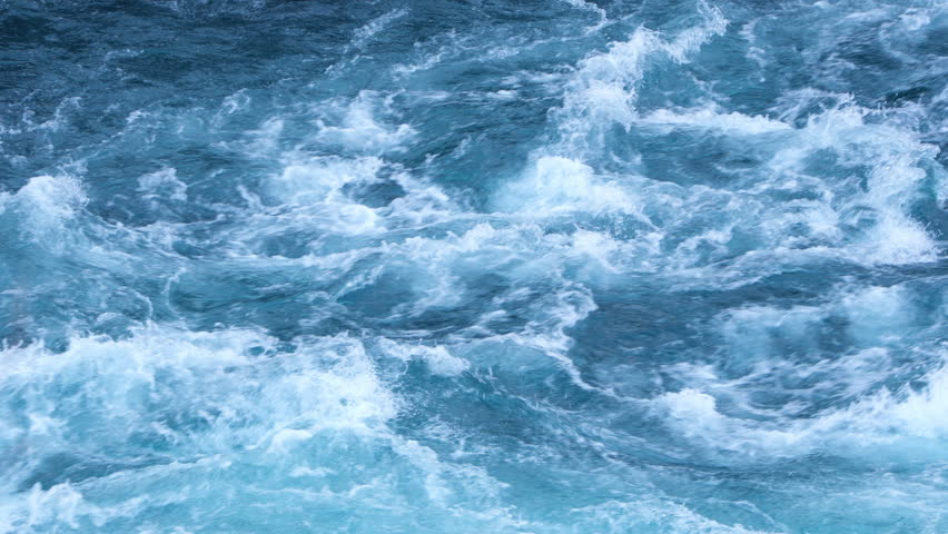 Pure turquoise river with a big current. Water from melted glacier flows.
