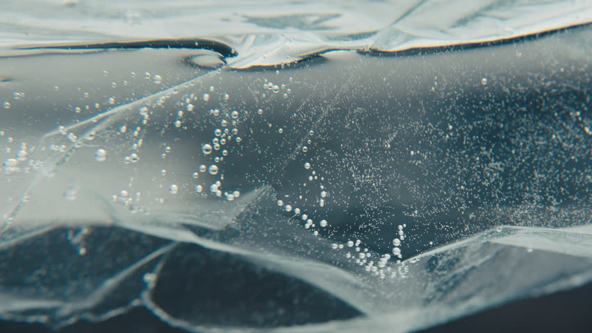 Abstract plastic floating on water with bubbles | Shutterstock HD Video #1100518165