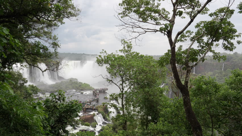 Unrecognized Tourists at Iguazu Falls on the border of Brazil and Argentina 