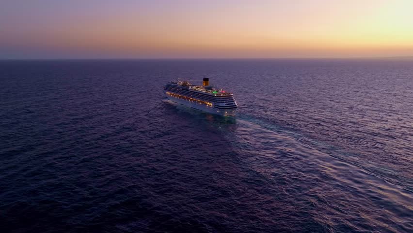 Aerial view of PACIFIC COAST CRUISE DEPARTING FROM PORT OF SANTO DOMINGO On CARIBBEAN SEA during golden sunset Royalty-Free Stock Footage #1100522195
