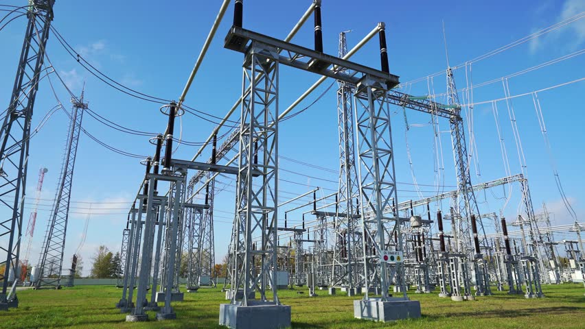 Handheld, power and energy, transportation of electricity, huge power station, view of the steel towers with wires.