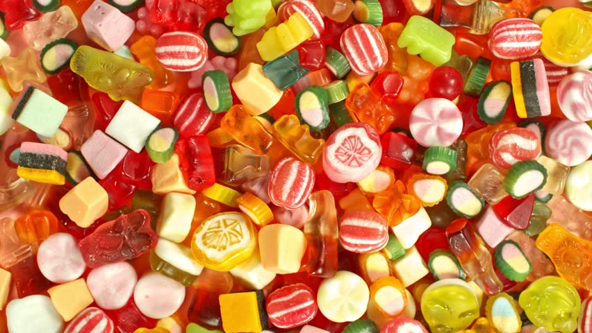 Super slow motion of flying candies up in the air. Camera in super fast motion. Filmed on high speed cinema camera, 1000 fps, placed on high speed cine bot.