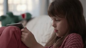 Teenage Girl Focused on the Screen of the Digital Tablet