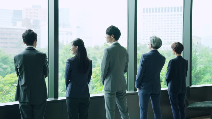 Group of businessperson looking out from the office. Business outlook. Management strategy. | Shutterstock HD Video #1100534511