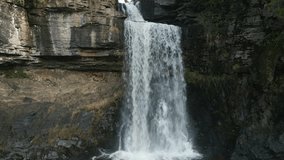 Waterfall slow motion pull away from close up at Ingleton Waterfalls Trail Yorkshire UK