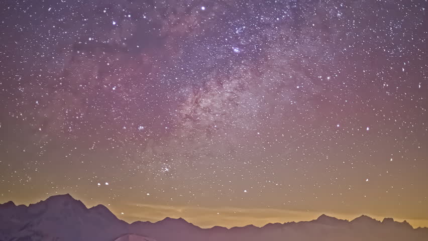 Time lapse shot of moving stars at night sky with flying meteors above mountain range silhouette - wide shot | Shutterstock HD Video #1100535193