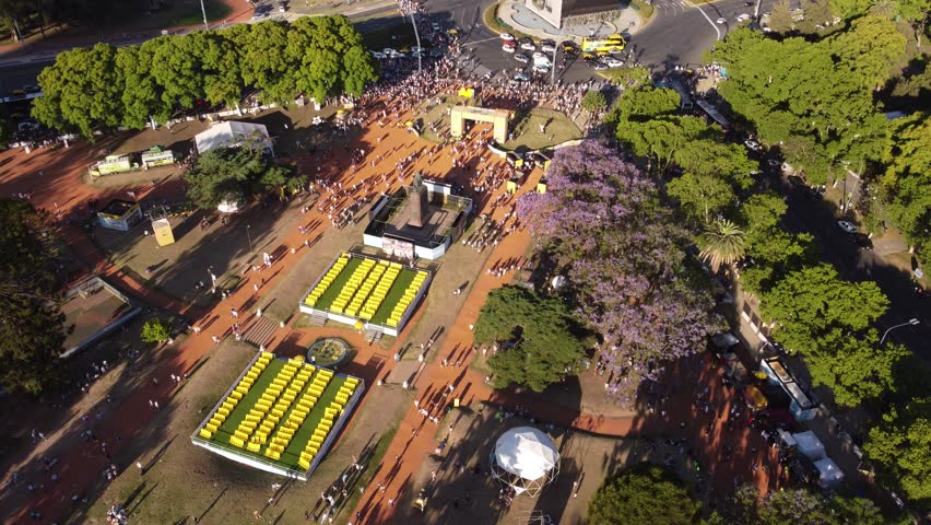 Argentinian football supporters walking close to Magna Carta monument, Buenos Aires city in Argentina. Aerial top-down view