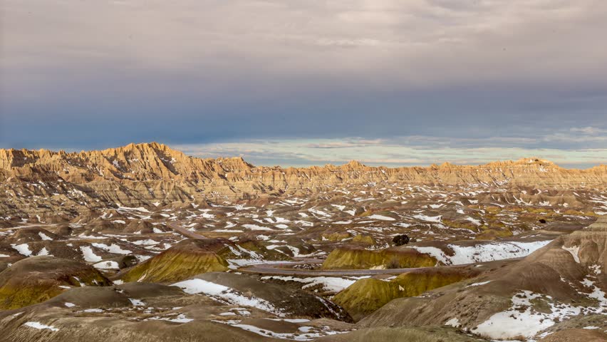 Rugged Beauty Of Badlands National Park In The Morning Light In South Dakota With Clouds Moving Above. timelapse