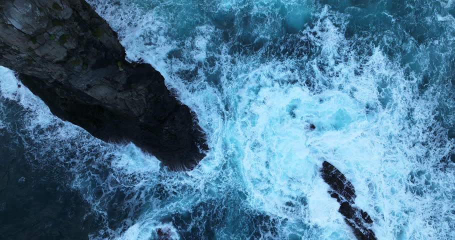 Ocean Waves Crashing On Jagged Coastline of Ponta de Sao Lourenco In Madeira Island, Portugal. - aerial overhead Royalty-Free Stock Footage #1100536099