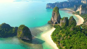 Magnificent scenery over Railay Beach, coastal limestone mountains. Krabi, Thailand. Popular destination for travellers from around the world. beach video background. Vacation and relaxation concept
