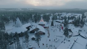 Santa Claus Village Shooting at Santa Claus near Rovaniemi in Lapland - Finland. Ice hotel with ice bar and restaurant services. carved ice walls. drone videos. Night at Santa Claus. Lights and snow.  - Powered by Shutterstock - Get 15% off with code: PIKWIZARD15