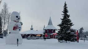 Santa Claus Village Shooting at Santa Claus near Rovaniemi in Lapland - Finland. Ice hotel with ice bar and restaurant services. carved ice walls. drone videos. Night at Santa Claus. Lights and snow. 